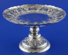 A Victorian silver tazza, with turned waisted stem and embossed with flowers and fruit amongst