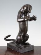 An early 20th century patinated bronze model of a rearing panther, on a rectangular grey marble