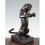 An early 20th century patinated bronze model of a rearing panther, on a rectangular grey marble