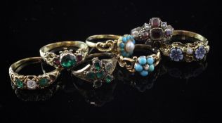 Seven assorted late Victorian and Edwardian gold and gem set rings, including emerald, ruby and