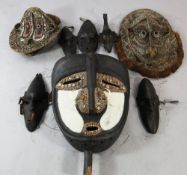 A Papua New Guinea Sepik River large carved wooden mask, painted in black and white and applied with