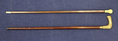 A 19th century ivory handled square section walking cane, with ivory ferrule, together with a