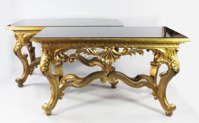 A pair of large Baroque revival carved giltwood console tables, by Christopher Guy, with rectangular