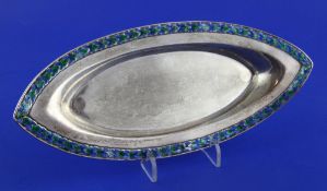 An Edwardian Arts & Crafts silver and enamel shallow dish by Liberty & Co, of navette shape, with
