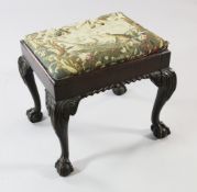 A mid 18th century style mahogany rectangular stool, with tapestry drop in seat, on acanthus leaf