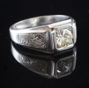 A 1940's 18ct white gold and solitaire diamond ring, with engraved shoulders and round cut diamond