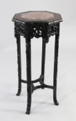 A Chinese rosewood octagonal jardiniere stand, with rouge marble inset top, pierced and carved