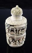 A Chinese tinted ivory snuff bottle and stopper, 1875-1900, carved in high relief and openwork