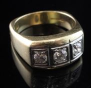 A gentleman's 14ct gold three stone diamond ring, the round cut stones with an approximate total