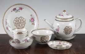 A Chinese Export famille rose part tea service, c.1770, each piece gilt decorated with the cypher