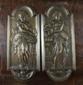 A pair of late 19th century bronze plaques, each depicting classical females, 15in.