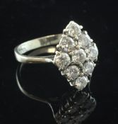 A Victorian style 18ct gold and diamond marquise shaped cluster ring, set with nine round cut