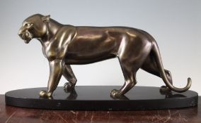 I. Rochard. A patinated metal figure of a panther, on an oval polished marble base, 22.5in.