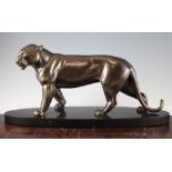I. Rochard. A patinated metal figure of a panther, on an oval polished marble base, 22.5in.