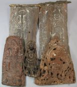 A Papua New Guinea Sepik River wooden storyboard, relief-carved and incised with a central figure