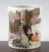 A Chinese famille rose brush pot, painted with chickens in a fenced rockwork garden and with an