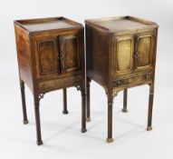 A pair of George III style mahogany bedside cupboards, with gallery tops above a pair of cupboard