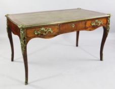 A Louis XV style ormolu mounted rosewood bureau plat, with gilt tooled inset skiver and three frieze