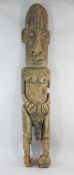 A Papua New Guinea Sepik River large carved wooden stylised male figure, with incised designs and
