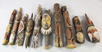 Papua New Guinea Sepik River, a collection of ten wooden ancestor heads, yam masks and house post