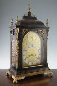 French, Royal Exchange London. A Victorian brass mounted ebonised bracket clock, the arched dial