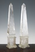 A pair of rock crystal obelisks, of typical tapering form, on stepped plinth bases, 16.5in.