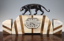 Attributed to Michel Decoux. A French Art Deco two tone marble clock garniture, the clock with