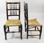 A harlequin set of six Country rush seat dining chairs, with spindle backs