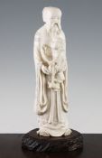 A large Japanese ivory figure of an old man holding a boy, early 20th century, the figure of a boy