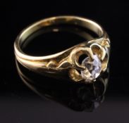A gold and claw set diamond solitaire ring, with old mine cut stone, size M.