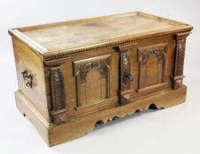 A 19th century Swiss walnut coffer, with recessed rectangular top, the front with chip carved