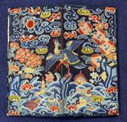 A Chinese Peking knot rank badge, c.1900, now mounted on a European evening bag, the bird amid