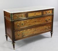 A Directoire brass mounted acajou moucheté commode, with marble top and three long drawers between