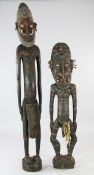 A Papua New Guinea Sepik River large carved wooden male ancestor figure, with incised and red and