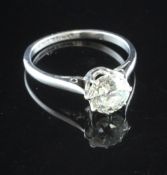 A platinum and solitaire diamond ring, the round cut stone weighing approximately 1.50ct, size N.