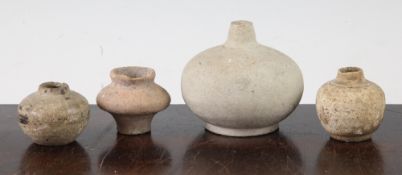 Four South East Asian pottery jarlets, c.300 AD, each of globular form, largest 6.5cm