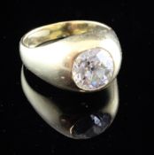 A gentleman's 18ct gold solitaire diamond ring, the round cut stone weighing approximately in excess