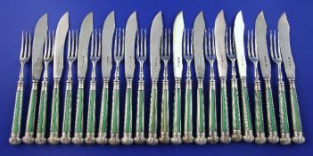 A set of twelve George V silver and stained ivory handled silver fruit eaters by the Goldsmiths &
