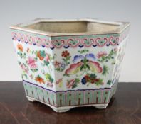 A Chinese famille rose hexagonal jardiniere, late 19th century, painted with butterflies, fruit