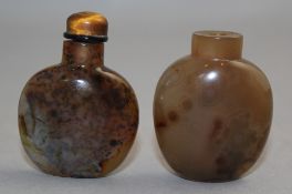 Two Chinese chalcedony snuff bottles, 1750-1900, both of flask form, the first with black speckled