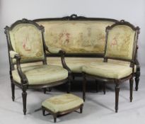 A late 19th century Louis XVI style nine piece salon suite, comprising of a settee, two open