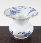A mid 18th century English? blue and white delftware spittoon, the flared trumpet rim decorated with