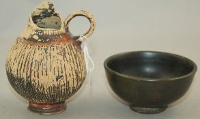 A Greek blackware bowl and a Gnathian ware oinochoe, Apulia, 4th / 5th century BC, the oinochoe of