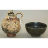 A Greek blackware bowl and a Gnathian ware oinochoe, Apulia, 4th / 5th century BC, the oinochoe of