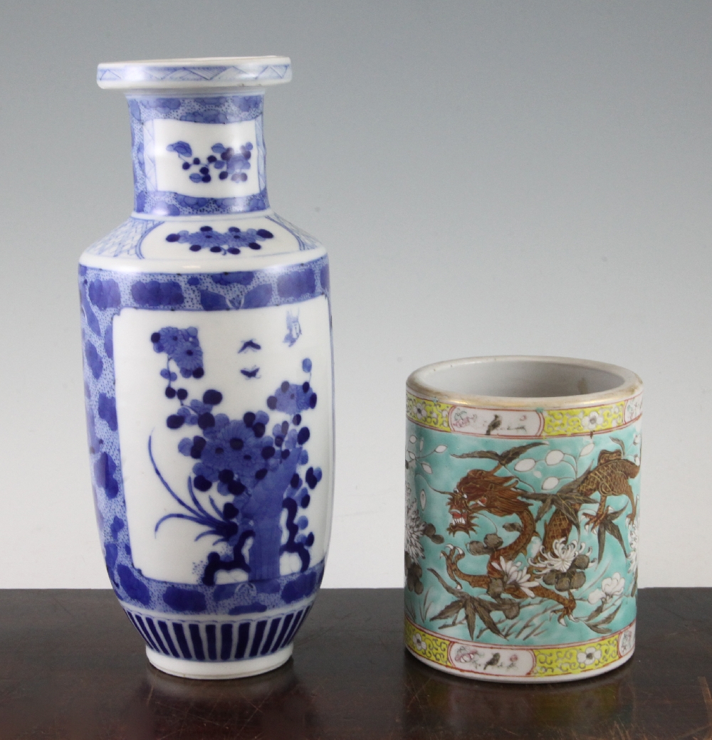 A Chinese blue and white rouleau vase and an enamelled porcelain brush pot, late 19th / early 20th
