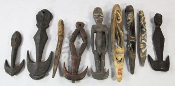 Papua New Guinea Sepik River, a collection of five carved wooden tribal food hooks, with ancestor