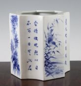 A Chinese blue and white brush pot, of octagonal outline, painted with bamboo, prunus, landscape and