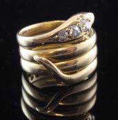 An 18ct gold and diamond serpent ring, set with three graduated old mine cut diamonds, gross 13.5