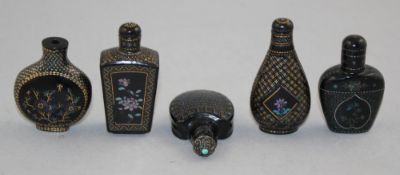 Five Chinese lacque burgaute snuff bottles, 1900-1950, of varying form decorated with flowers and