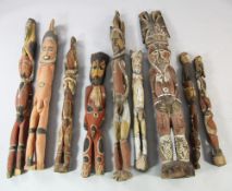 Papua New Guinea Sepik River, a collection of nine wooden ancestor house post figures, male and